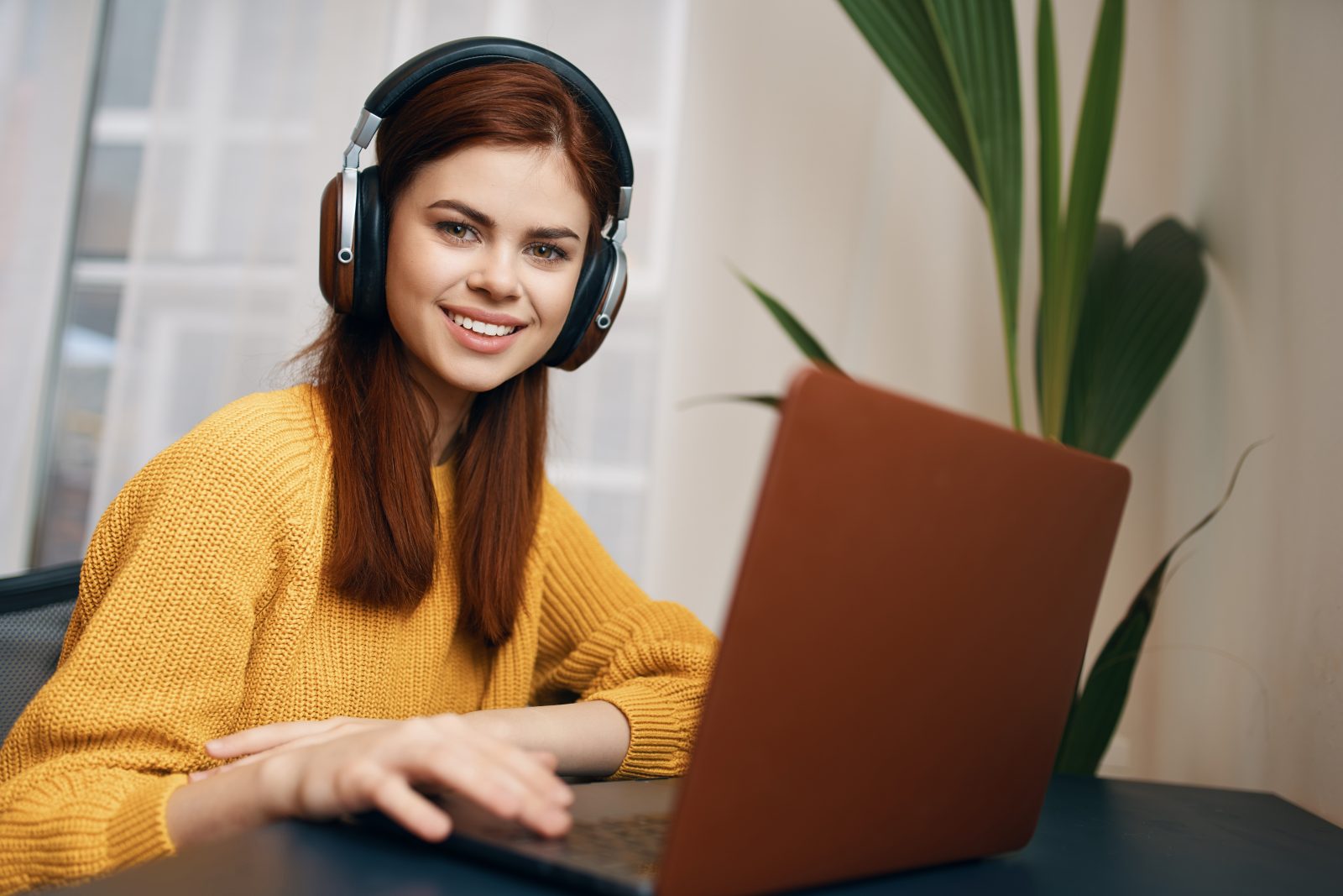 woman working on her laptop at home