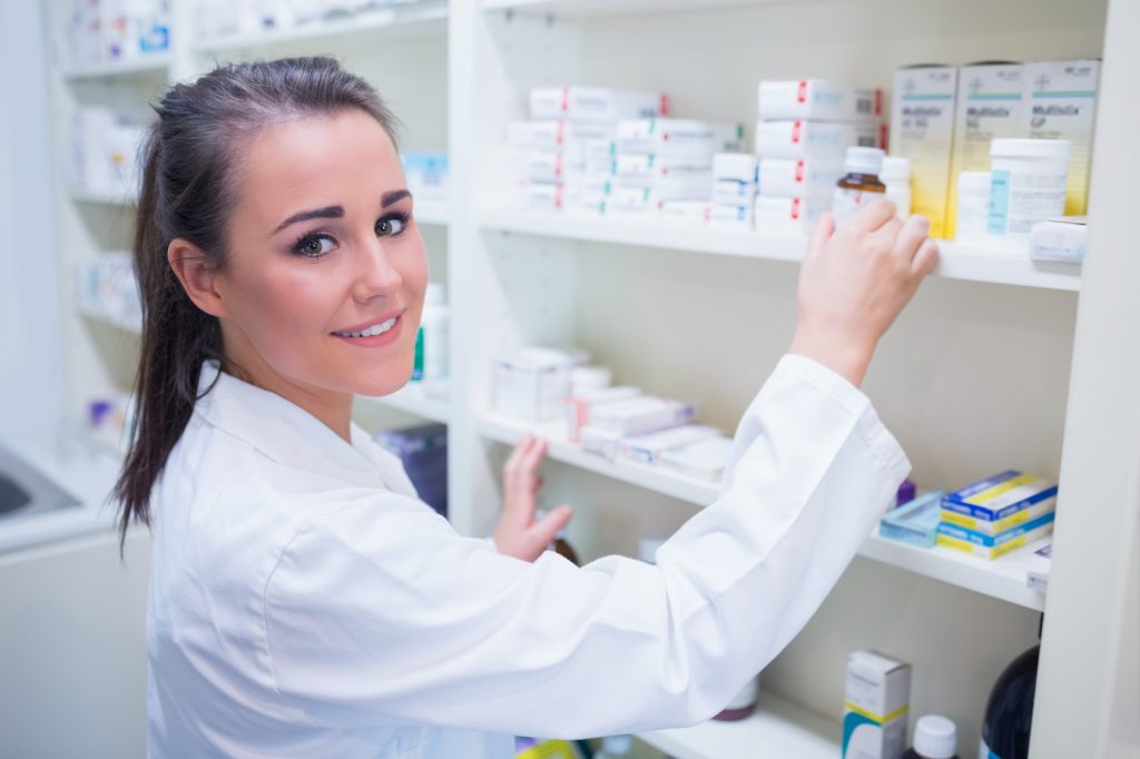 Smiling student taking jar from shelf
