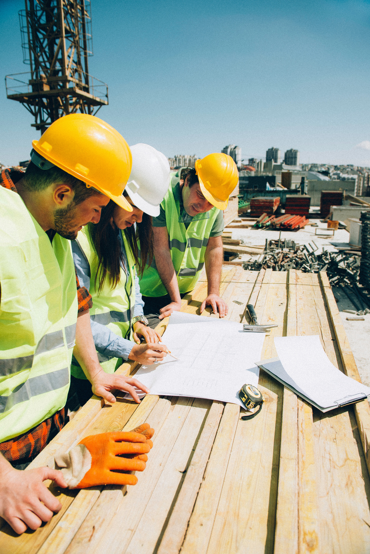 Architect and construction workers. Toned image